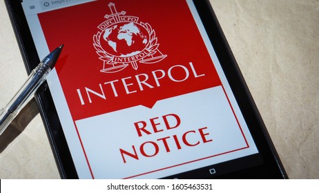 Bordeaux, France - January 04, 2020 : Interpol Red Notice displayed on mobile phone screen Top urgent procedure.
