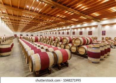 Bordeaux , France - May 10 , 2017 : Wines fermenting in traditional large oak barrels in the wine cellar