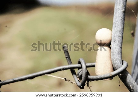 Border with a barrier between countries to stop and banish immigration and refugees. A barbed wire and fence to indicate property boundaries.