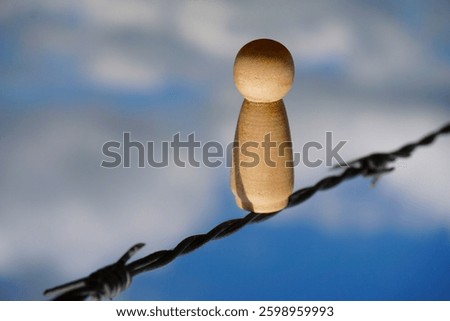 Border with a barrier between countries to stop and banish immigration and refugees. A barbed wire and fence to indicate property boundaries.