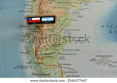 The border between Argentina and Chile, accompanied by the flags of both countries