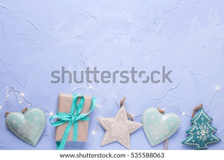 Similar – Image, Stock Photo turquoise and silver stars hang as decoration on a white paper bag