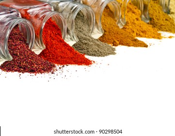 border of  colorful powder spices in glass bottle with copy space , isolated on white background - Powered by Shutterstock