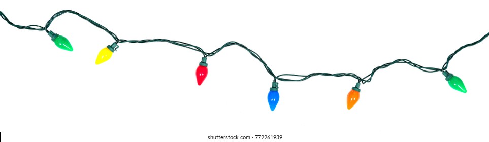 Border of festive colorful holiday light string isolated on white