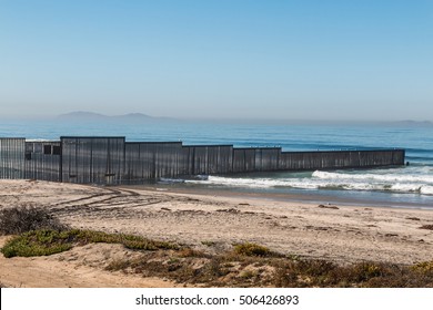 Border Field State Park beach with the international border fence between Tijuana, Mexico and San Diego, California, along with the Islas Los Coronados islands in the background.