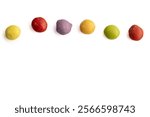 Border made of Dye-free natural candy with no artificial ingredients isolated on a white background in groups based on the color, healthier alternative, good option for ADHD children