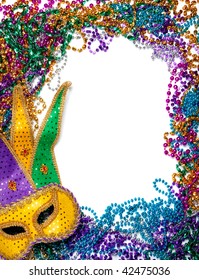 A border made of a gold, purple and green mardi gras mask and blue, green, red, gold and purple plastic beads