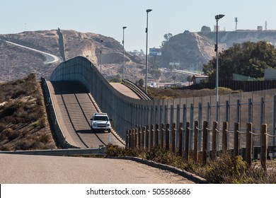 Border Patrol vehicle patrolling along the fence of the international border between San Diego, California and Tijuana, Mexico - Shutterstock ID 505586686