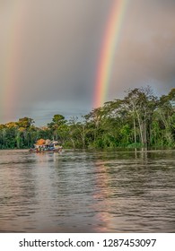 Border Of Peru And Brazil - May 05, 2016: Rainbow Over The Boat On Amazon River Latin America. Javarii River. Yavarii River.