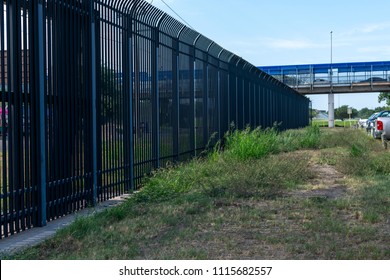 Border Wall Between Texas US Mexico Border Underneath The International Bridge Port Of Entry