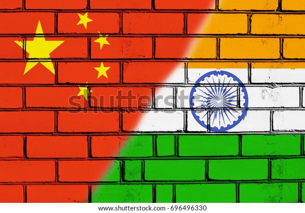 The border wall.\
Two flags. China. India.