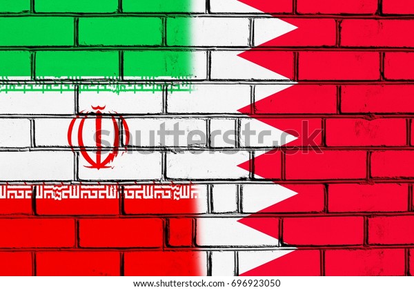 The border wall.\
Two flags. Iran. Bahrain.