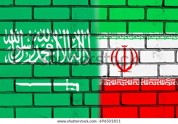 The border\
wall. Two flags. Saudi Arabia.\
Iran.
