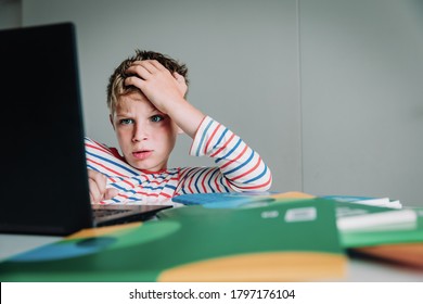 Bored And Agressive Kid Looking At Computer, Boy Angry To Get Too Much Homework