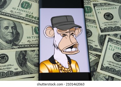 Bored Ape Yacht Club #9055 NFT seen on smartphone placed on dollars. NFT digital art purchased by Eminem. Stafford, United Kingdom, January 5, 2022.