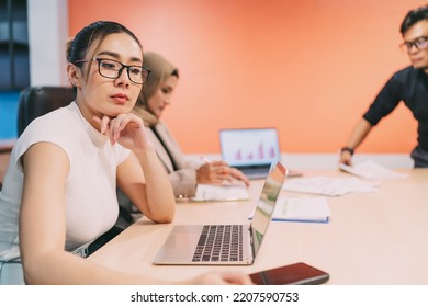 Bored Asian Beautiful Business Woman In Meeting. An Exhausted Female Employee Tired Of Boring Conference And Want Leaving. Boring Meeting Make Office Worker Lose Focus And Sleepy In Convention Room.