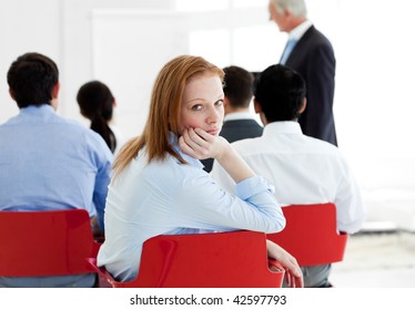 Bored Businesswoman At A Conference With Her Colleagues