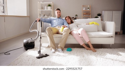 Bored Family After Cleaning House Room- Exhausted Couple - Powered by Shutterstock