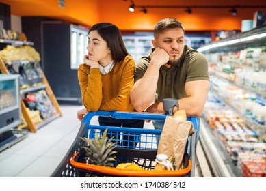 Bored family couple in grocery store - Powered by Shutterstock