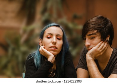 Bored friends thinking outdoors. Couple of teenagers after arguing - Shutterstock ID 1214222308