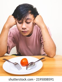 Bored Man Eating Only One Tomato For Diet