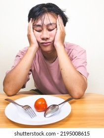 Bored Man Eating Only One Tomato For Diet