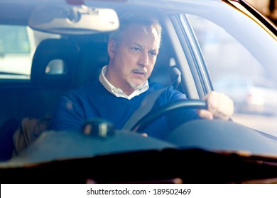 Bored Mature Man Driving His Car