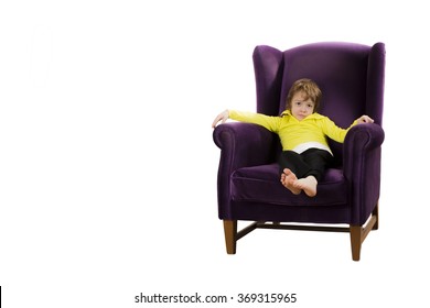 Bored Red Hair Boy Sitting On The Purple Couch