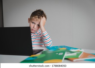 Bored And Sad Teenager Looking At Computer, Kid Tired Of Online Communication And Learning