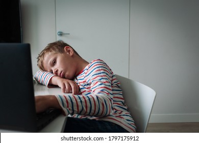 Bored And Sad Teenager Looking At Computer, Kid Tired Of Online Communication And Learning