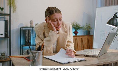 Bored Sleepy Business Woman Worker Working On Laptop Computer, Yawning, Leaning On Hand Falling Asleep At Office Workplace. Exhausted Tired Freelancer Workaholic Woman. Employment Occupation, Workless