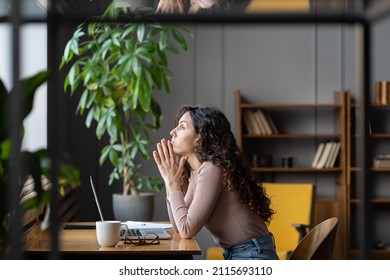 Bored unmotivated female worker sit at office desk with laptop tired of looking for problem solution, businesswoman need inspiration to make monotonous work or uninteresting task. Lack of motivation - Shutterstock ID 2115693110