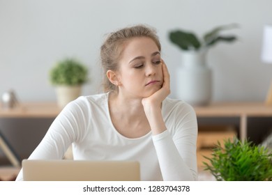 Bored Unmotivated Millennial Woman Thinking Of Dull Work Disinterested In Study On Laptop, Lazy Absent-minded Girl Student Wasting Time Tired Of Monotonous Routine, Boredom And Lack Of Ideas Concept