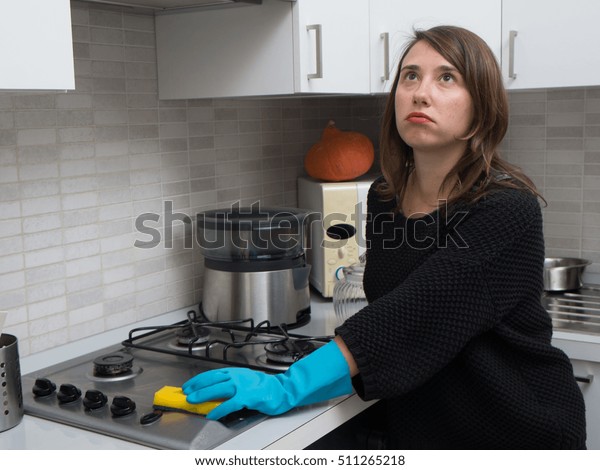 Bored Woman Cleaning Stainless Steel Gas Stock Photo Edit Now