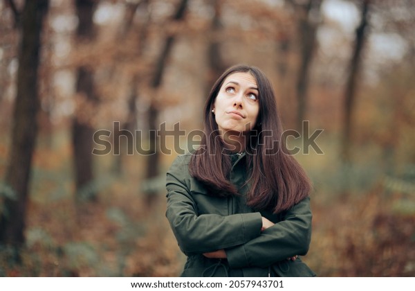 Bored Woman Looking at Foliage in Autumn\
Season. Young person suffering from seasonal affective disorder\
during fall feeling alone and upset\
\
\
