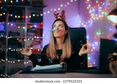 
Bored Woman Procrastinating while Working during Christmas Time
Unhappy young worker protesting holidays schedule at the office
