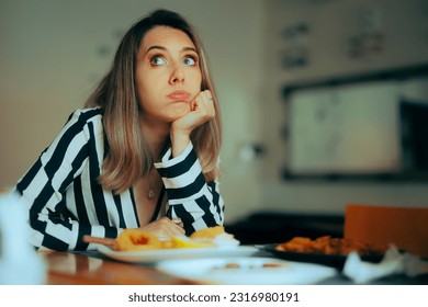 
Bored Woman Sitting in a Restaurant Not Eating her Food. Picky eater hating the service in a diner refusing to eat 
 - Powered by Shutterstock