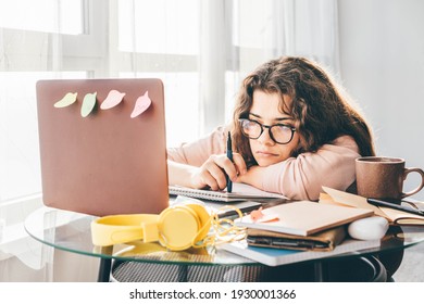 Bored woman studying at home. Student learning and working at home. - Powered by Shutterstock