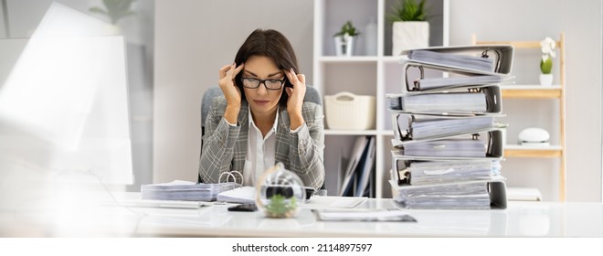 Bored Workaholic Accountant Businesswoman At Office Desk - Shutterstock ID 2114897597