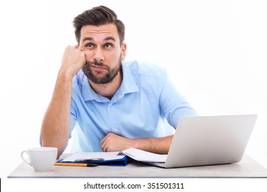 Bored Young Man At The Desk
