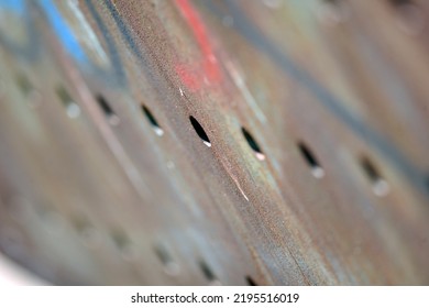 Boreholes In An Old, Rusty Metal Plate.