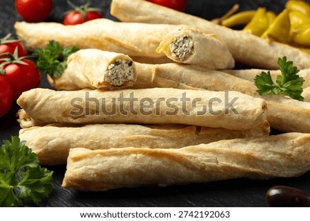Borek rolls, pastry crispy rolls of thin dough are stuffed with a creamy cheese and parsley.