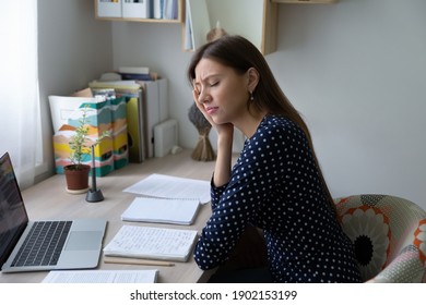 Boring Task. Sad Young Lady Sit At Home Office With Closed Eyes Distracted From Work Study Unwilling To Learn Dull Subject. Unhappy Woman Freelancer Feeling Tired Wincing Of Pain Suffering Of Headache