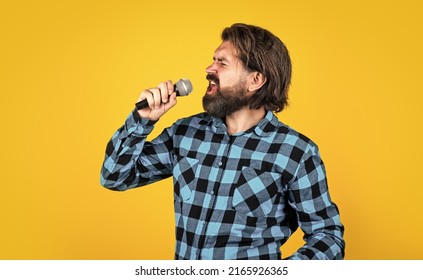 Born to rock. mature singer sing song. masculinity and charisma. having fun in karaoke club. bearded hipster singer with mic. music concept. brutal handsome man with moustache