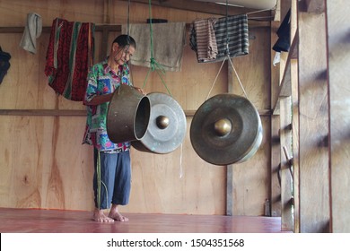 Borneo, Malaysia - February, 2017 - An Old Man Playing The Handmade Drums (gong Style) He Creates. Old Man Playing In The Region Of Kudat, North Of The Malaysia Part Of Borneo Island.