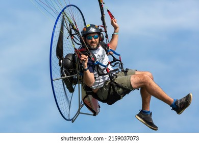BORNOS, SPAIN - Feb 20, 2020: A closeup of a man flying on the paramotor