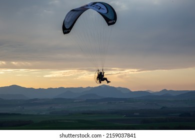 BORNOS, SPAIN - Feb 20, 2020: A closeup of a man flying on the paramotor