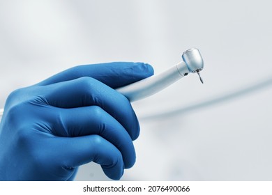 boron machine dental drill in the doctor's hand with water stomatology