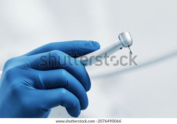boron machine dental drill in the doctor's
hand with water
stomatology