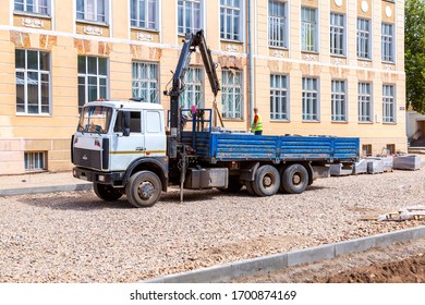 Borovichi, Russia - July 22, 2019: Delivery And Unloading Of Construction Materials For The Construction Of The New Road